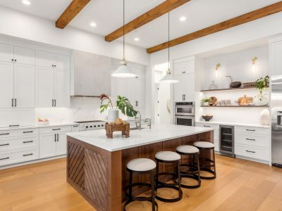 Beautiful Kitchen In New Luxury Home With Island Pendant Lights And Hardwood Floors