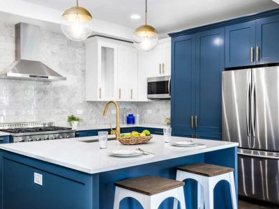 A Blue Kitchen With Stainless Steel Appliances