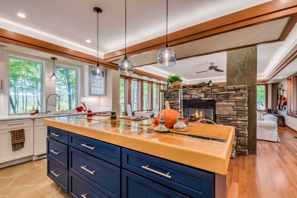 Kitchen Remodeling Services Open Kitchen With Stand Alone Fireplace In The Middle Of The Room